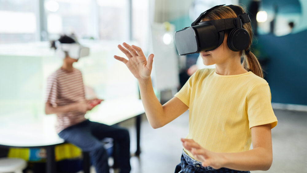 Children wearing VR headsets